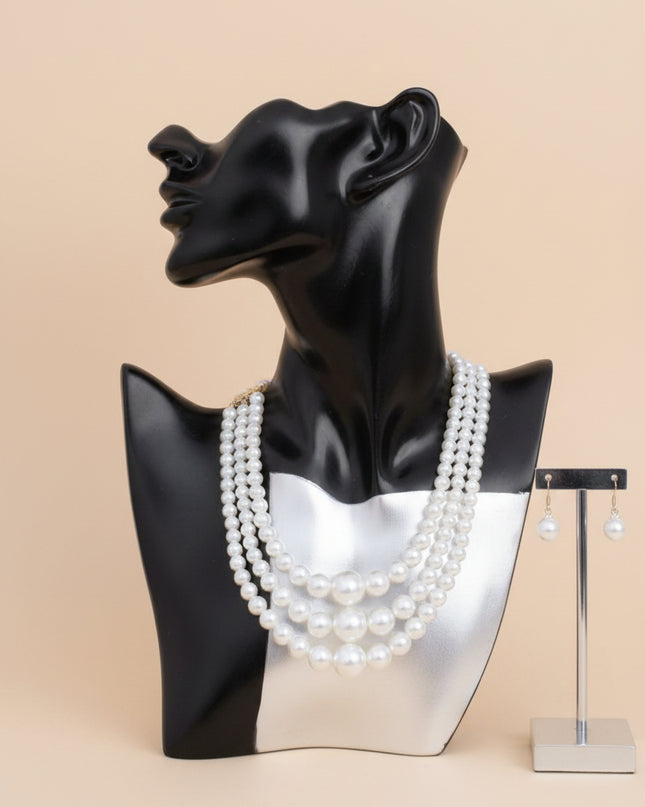 Women's Pearl Necklace Set. Updated Classic Graduated Cream Acrylic Pearl 3 Strand Set Featuring Center Jumbo Bubble Gum Pearl Detail. Bubblegum Pearls Measure 24mm. 