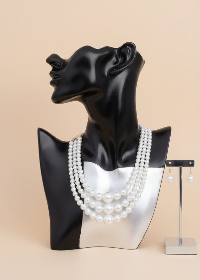 Women's Pearl Necklace Set. Updated Classic Graduated Cream Acrylic Pearl 3 Strand Set Featuring Center Jumbo Bubble Gum Pearl Detail. Bubblegum Pearls Measure 24mm. 