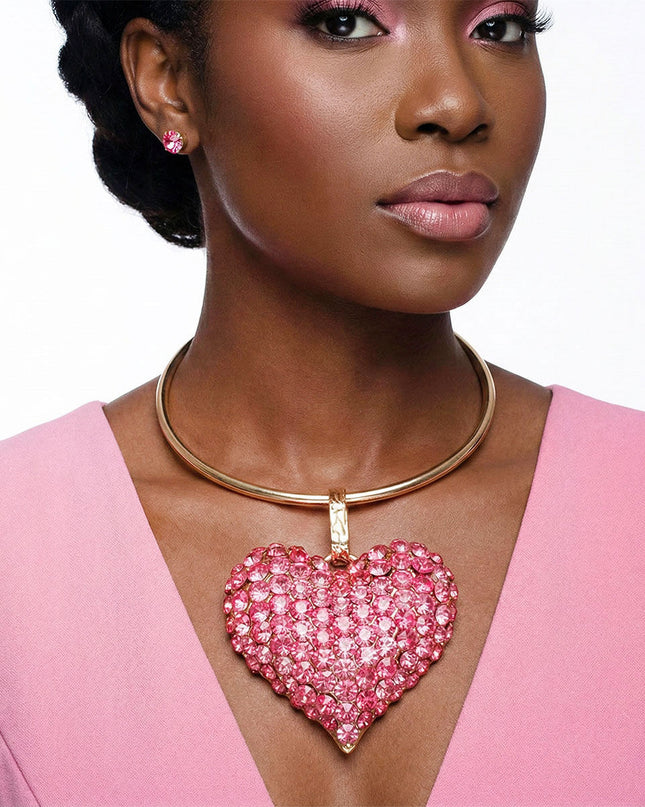 Women's Pendant Necklace Set. Fun and Flirty Gold Metal Rigid Collar Necklace Set Featuring Ultra Chunky XL Domed Heart Pendant with Fuchsia Rhinestone Detailing. 