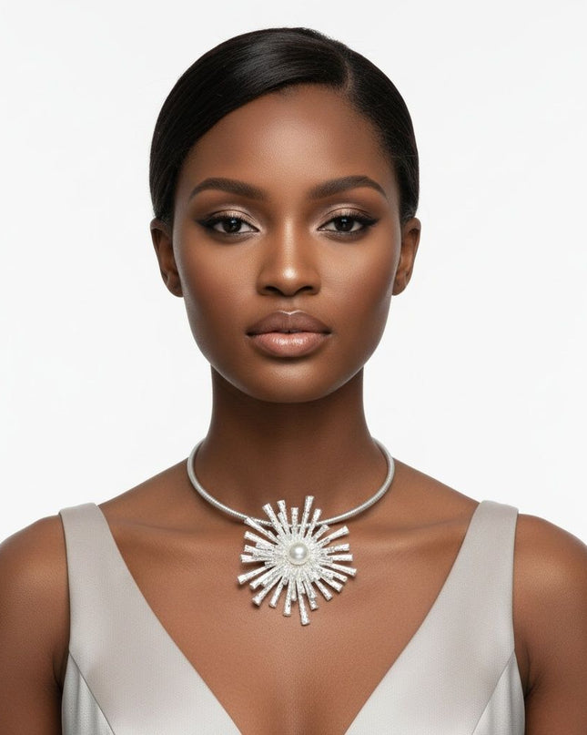 Women's Pendant Collar Necklace. Striking Rigid Matte Silver Metal Ribbed Texture Rigid Collar Necklace Featuring a Large Stacked Metal Sunburst Flower-Like Slide Pendant with Hammered Texture. Bold Sculptural Statement Piece. Pendant Measures 3.75 inches and .75 inches Tall. Lobster Clasp Closure.