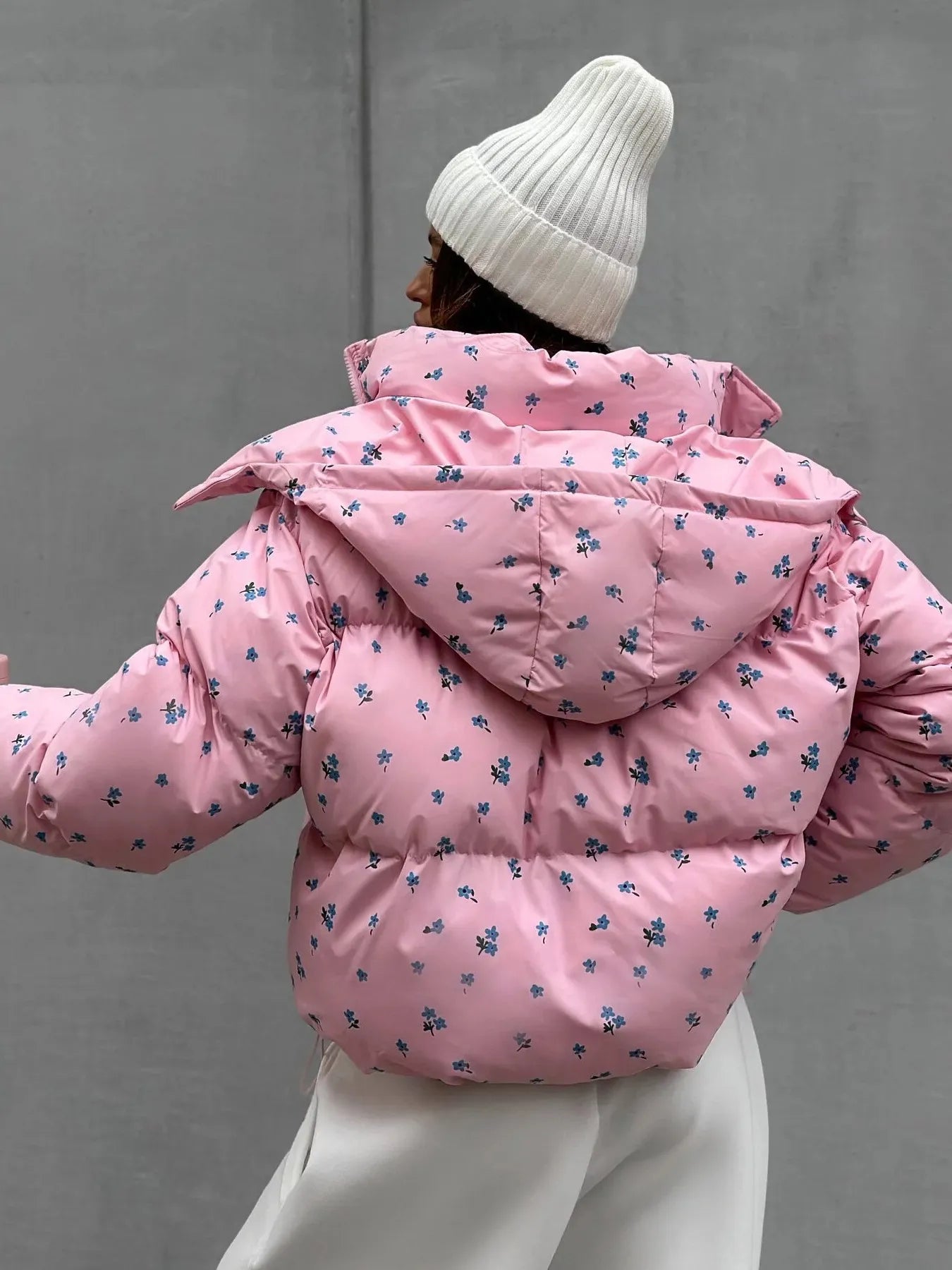 Pink puffer jacket with floral patterns 
