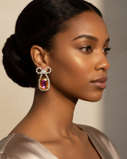 Women's Dangle Earrings. Vibrant Date Night Sparkle Gold Metal with Clear Pave Rhinestones Bow Shaped Earrings Featuring Drop Radiant Mixed Purple Orange Glass Crystal