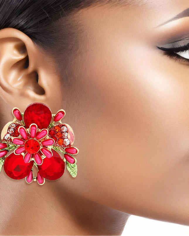 Women's Clip-On Earrings Gold Metal Flower Clip-Ons Featuring Red Teardrop Crystals, Rhinestones, Oblong Pearls, and Green Leaf Details. Paddle Back Clip-Ons.