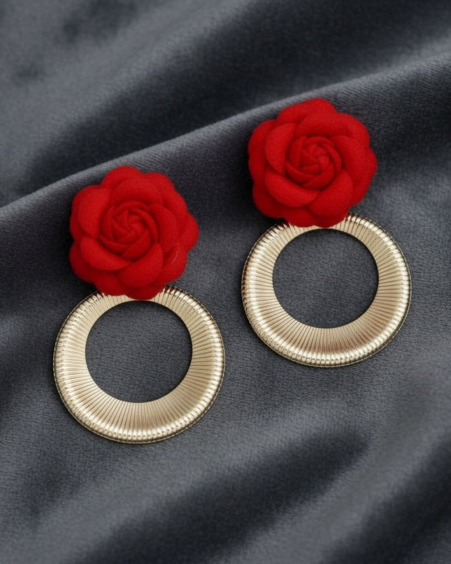 Women's Drop Earrings. Eye-Catching Drop Earrings Featuring a Vibrant Red Felt Fabric Rose Flower with Dimensional Petals Paired with a Sleek Gold Metal Ribbed Texture Ring Drop Detail. Modern and Charming. Post Backing.