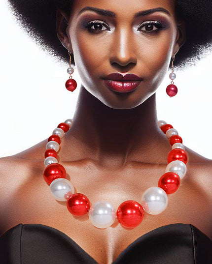 Single Strand Red and White Graduated Bubble Gum Pearl Necklace Set. Center Pearl measures 1.15 inches long.