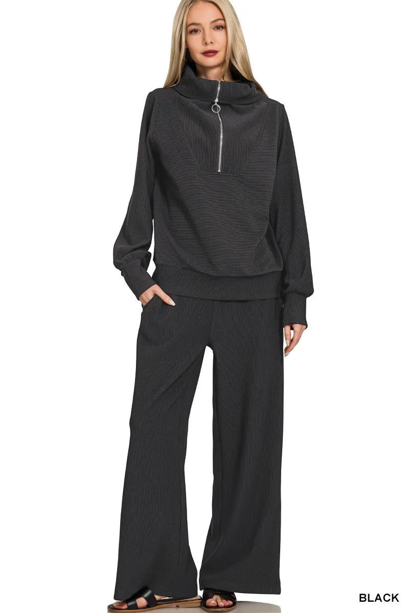 A Ribbed high-neck half-zip pullover & Pants Set is a cozy and stylish outfit that offers both comfort and fashion. The ribbed fabric adds texture and dimension to the set, creating a trendy and modern look. The high-neck pullover adds a touch of elegance and warmth, while the half-zip detail allows for easy adjustments and styling. Paired with matching pants, this set provides a coordinated and put-together appearance that is perfect for lounging at home or running errands in style. 