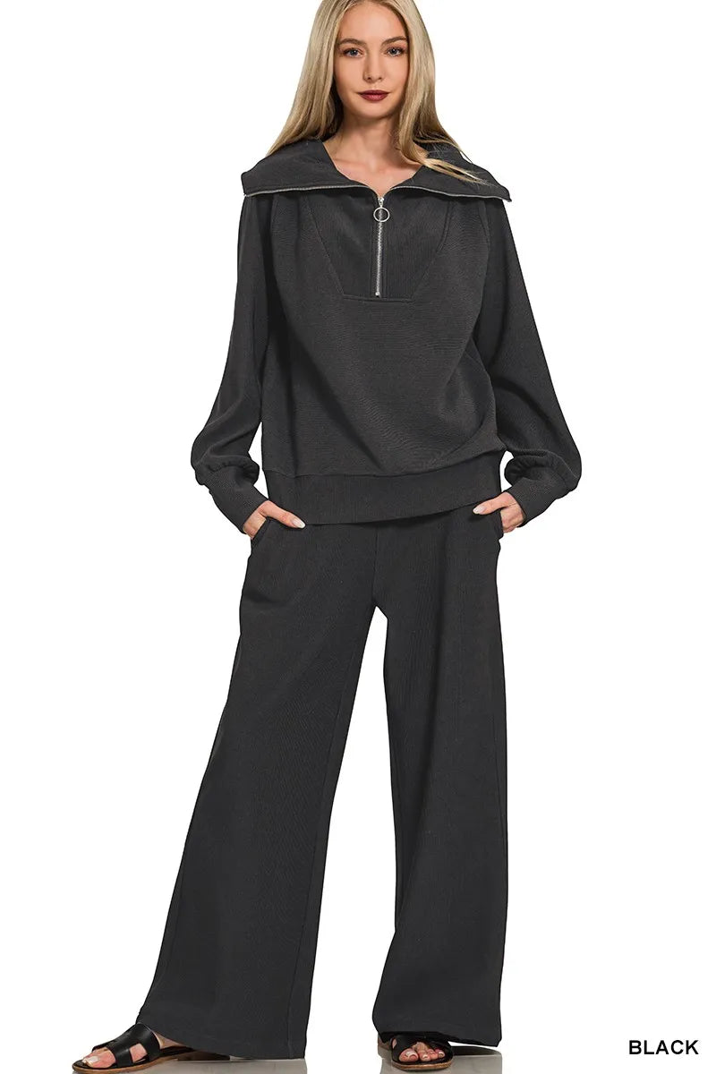A Ribbed high-neck half-zip pullover & Pants Set is a cozy and stylish outfit that offers both comfort and fashion. The ribbed fabric adds texture and dimension to the set, creating a trendy and modern look. The high-neck pullover adds a touch of elegance and warmth, while the half-zip detail allows for easy adjustments and styling. Paired with matching pants, this set provides a coordinated and put-together appearance that is perfect for lounging at home or running errands in style. 