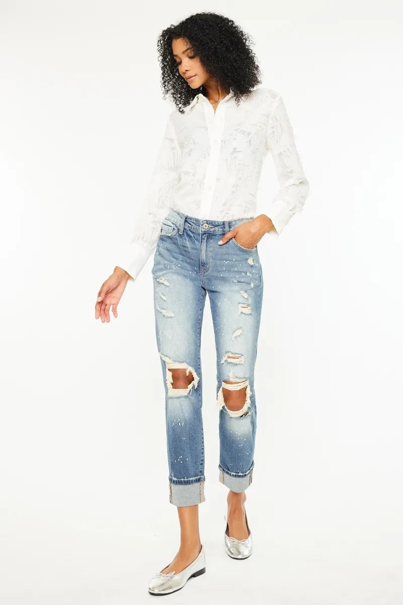 The edgy distressed details add a touch of cool and casual vibe to the classic boyfriend jeans style. 