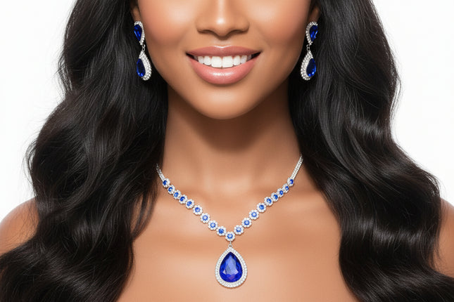 Women's Pendant Necklace Set Formal Silver Metal with Clear Pave Rhinestone Necklace Featuring Sparkling Royal Blue Crystal Details and Royal Blue Crystal Teardrop Pendant.