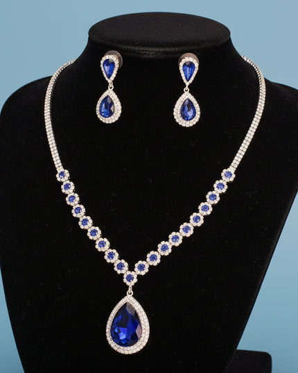 Women's Pendant Necklace Set Formal Silver Metal with Clear Pave Rhinestone Necklace Featuring Sparkling Royal Blue Crystal Details and Royal Blue Crystal Teardrop Pendant.