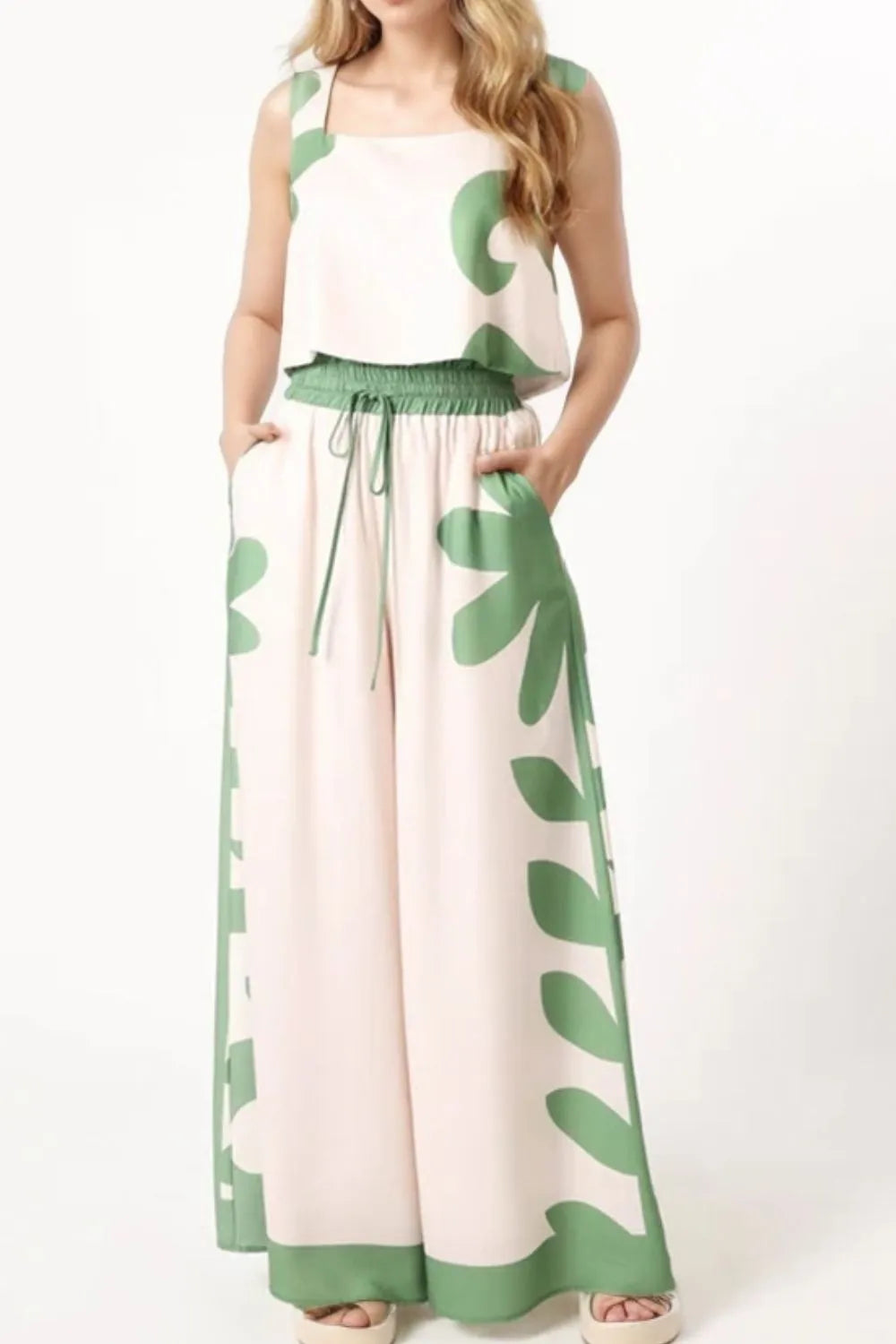 Sleeveless top and wide-leg pants with green leaf patterns