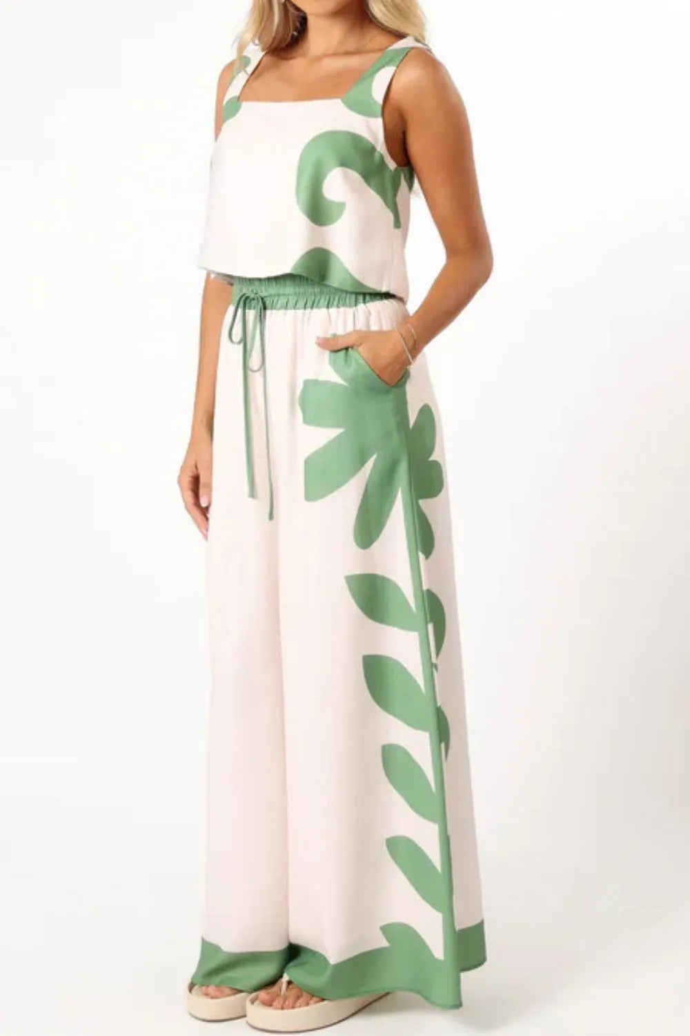 Sleeveless top and wide-leg pants with green leaf patterns