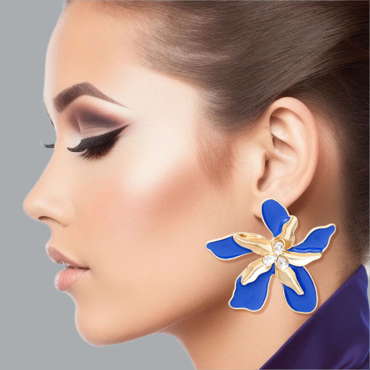 Women's Stud Earrings Textured Gold Metal with Blue Epoxy Tropical Iris Flower Earrings Featuring Rhinestone Centers. Post Backing.