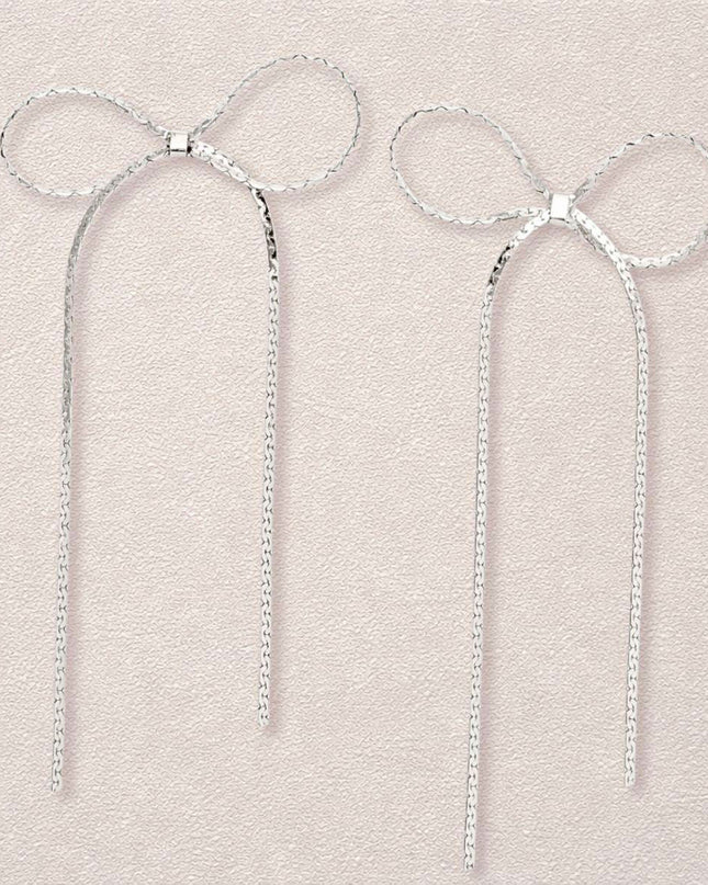 Women's Dangle Earrings. Simple Elegance Silver Metal Ribbon Bow Shaped Earrings Featuring Long Drop Detail. Post Backing.