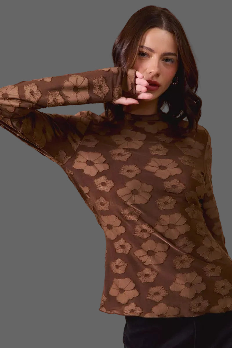 These casual tops are crafted from a stretchy jacquard fabric that offers both comfort and style. The thumb openings add a trendy and practical detail, perfect for keeping your hands warm on chilly days.