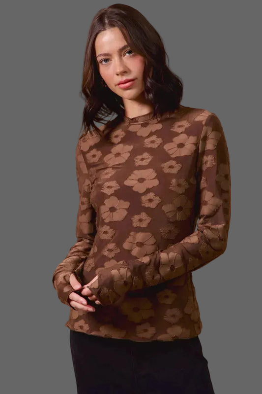 These casual tops are crafted from a stretchy jacquard fabric that offers both comfort and style. The thumb openings add a trendy and practical detail, perfect for keeping your hands warm on chilly days.