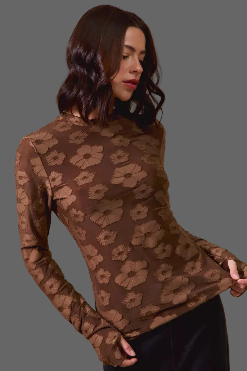 These casual tops are crafted from a stretchy jacquard fabric that offers both comfort and style. The thumb openings add a trendy and practical detail, perfect for keeping your hands warm on chilly days.