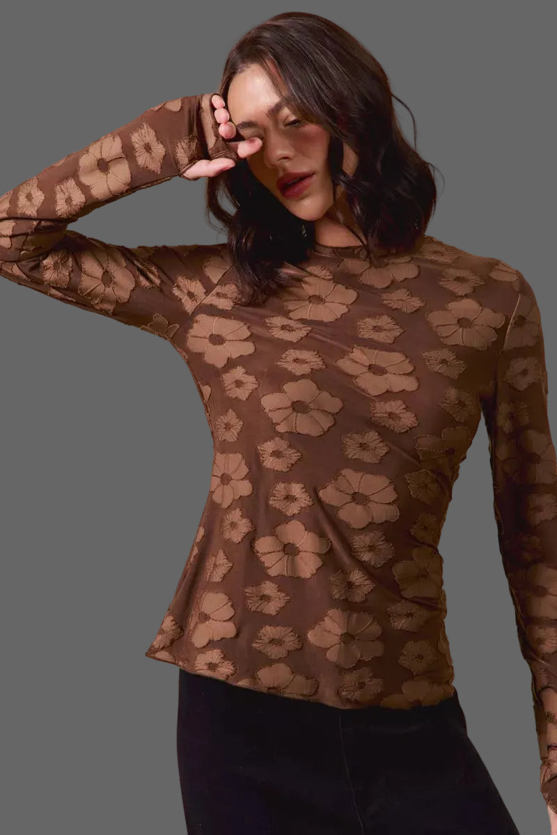 These casual tops are crafted from a stretchy jacquard fabric that offers both comfort and style. The thumb openings add a trendy and practical detail, perfect for keeping your hands warm on chilly days.