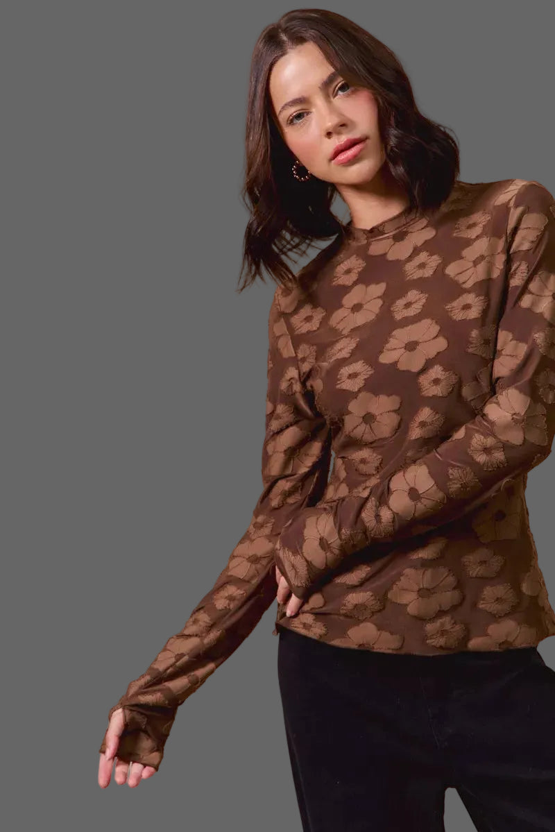 These casual tops are crafted from a stretchy jacquard fabric that offers both comfort and style. The thumb openings add a trendy and practical detail, perfect for keeping your hands warm on chilly days.