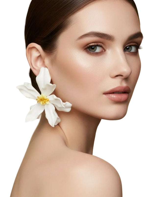 Women's Stud Earrings. Floral Statement Oversized Stud Earrings Featuring Large Dimensional Wavy Acrylic Petals in Dreamy Cream with an Orange and Yellow Beaded Center. Bold and Eye-Catching Floral Playful Elegance. Earrings Measure 4.25 inches and 2.25 inches Tall. Post Backing.