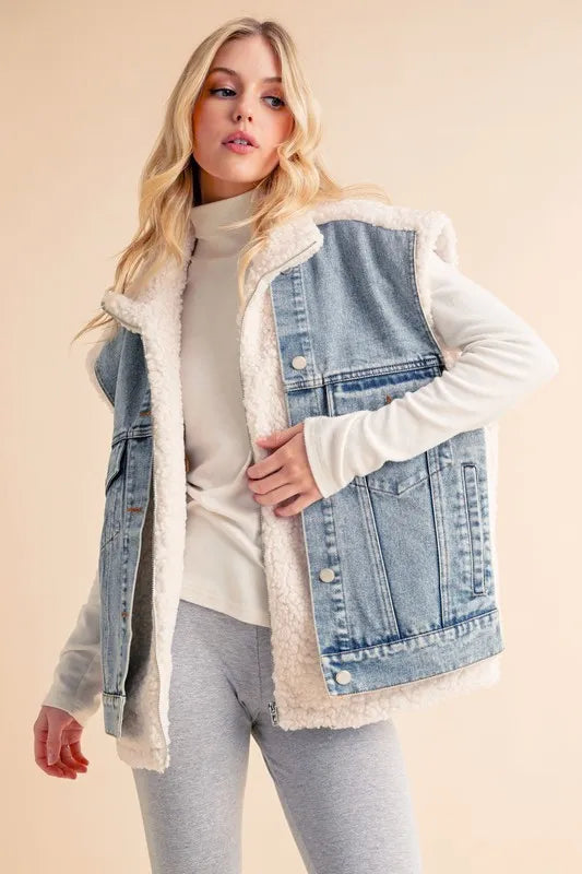 The denim patch Sherpa vest coat is a trendy and stylish outerwear option. Featuring a combination of denim and Sherpa materials, it offers a chic layered look. With the Sherpa lining's warmth and the versatile design, this piece is a great choice for adding both style and comfort to your outfit.