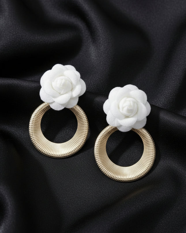 Women's Drop Earrings. Eye-Catching Drop Earrings Featuring a Vibrant White Felt Fabric Rose Flower with Dimensional Petals Paired with a Sleek Gold Metal Ribbed Texture Ring Drop Detail.