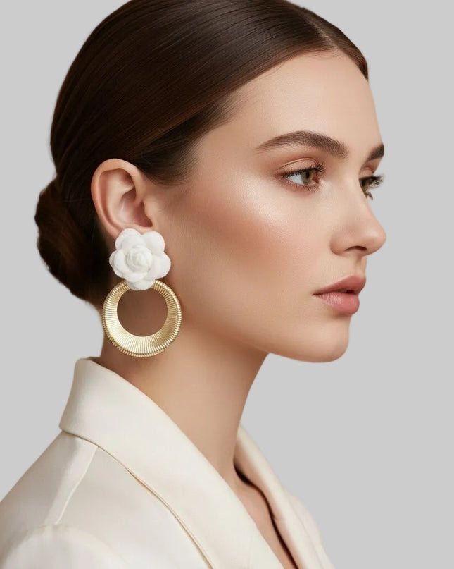 Women's Drop Earrings. Eye-Catching Drop Earrings Featuring a Vibrant White Felt Fabric Rose Flower with Dimensional Petals Paired with a Sleek Gold Metal Ribbed Texture Ring Drop Detail.