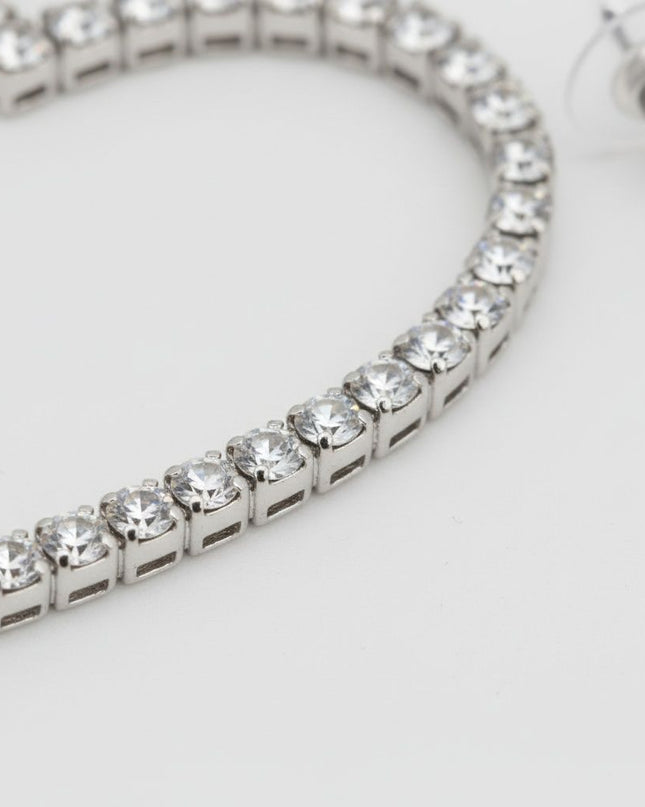 Women's Hoop Earrings. Sweet Sparkle Silver Metal Heart Shaped Open Hoop Earrings Featuring Clear Pave Rhinestone Detailing. 