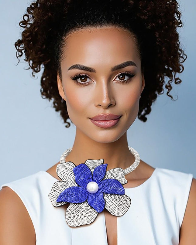 Zeta Phi Beta Sorority Paraphernalia Women's Choker Necklace. Sparkling Sorority Handcrafted Brilliance Thick Rigid Clear Rhinestone Encrusted Tube Choker Necklace Featuring Large Offset 3D Royal Blue and Clear Rhinestone Layered Petals Flower with Acrylic Pearl Center. 