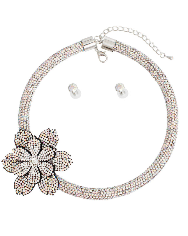 Women's Choker Necklace Set Bling Aurora Borealis Rhinestone Coated Rigid Tube Choker Featuring Elegant Layered Flower Rhinestone Offset Detail. Silver Metal Lobster Clasp Closure. Black Felt Backing on Flowers. Flower measures 2.5". Includes Matching Rhinestone Stud Post Earrings.