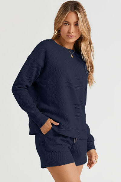 Stylish textured fabric, this full-size set features long sleeve top and matching draws, making it the perfect outfit for lounging, casual outings, or running errands.

Top Features:

Relaxed fit with a drop-shoulder silhouette for a laid-back vibe

Textured knit fabric adds subtle dimension and interest

Crew neckline for a classic, clean look

Long sleeves with cuffed hems to keep the chill away

Slightly tunic-length hem—great for wearing tucked or untucked