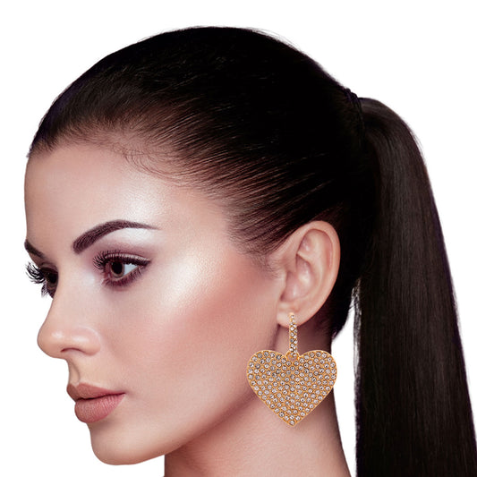 Gold Metal and Clear Crystal Rhinestone Huggie Hoop Earrings Featuring Heart Detail. Earrings measure 1.5 inches wide.
