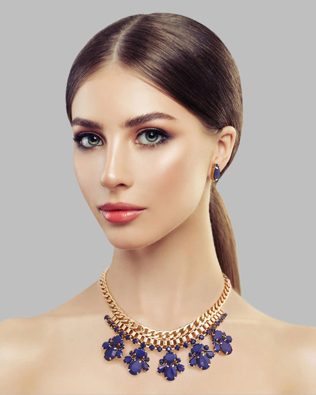 Navy blue bead and gold necklace set featuring elegant beadwork and shimmering gold accents, paired with matching earrings for a sophisticated look.