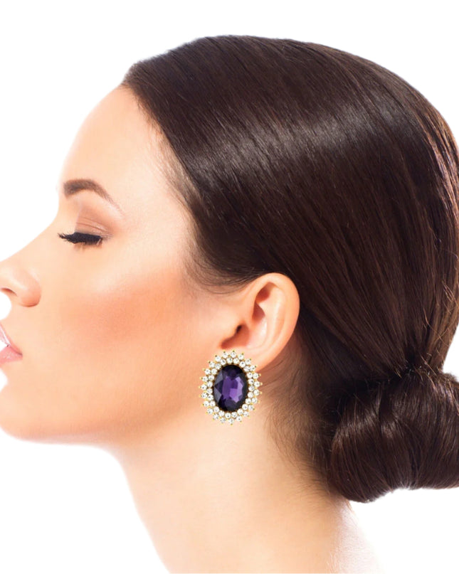Gold Metal Oval Stud Earrings Featuring Purple Crystal with Rhinestone Trim. Earrings measure .85 inches wide