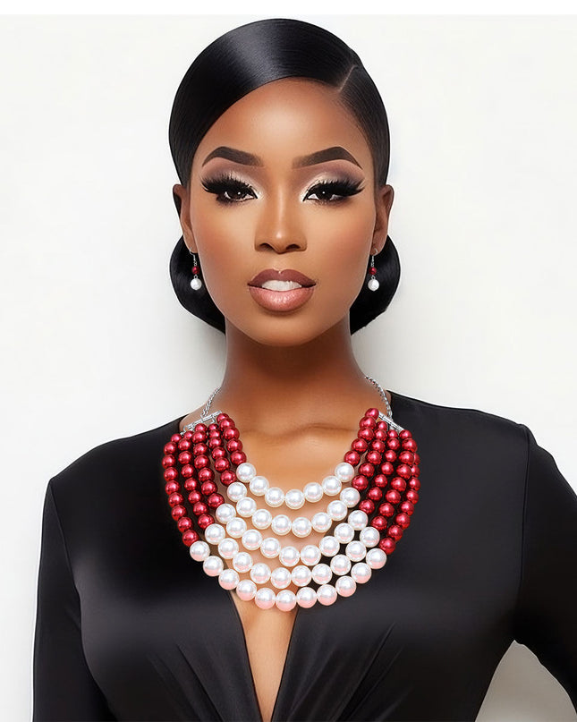  Featuring five cascading layers of lustrous cream pearls beautifully contrasted with bold red accents, this piece radiates sophistication and grace. The multi-strand design adds depth and drama, making it the perfect accessory for weddings or formal events