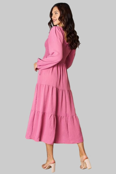 Pink tiered, ruffled smocked dress