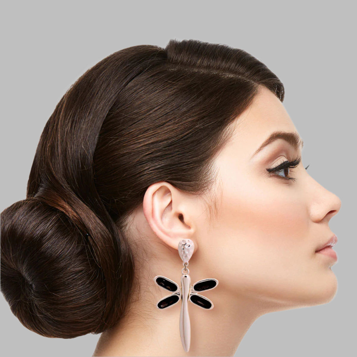 Silver Matte Metal Drop Dragonfly Earrings Featuring Black Diamond Crystal Wings. Earrings measure 1.5 inches wide.