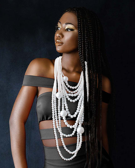 A bold 9‑strand white pearl necklace that adds instant shine and statement elegance to any look.